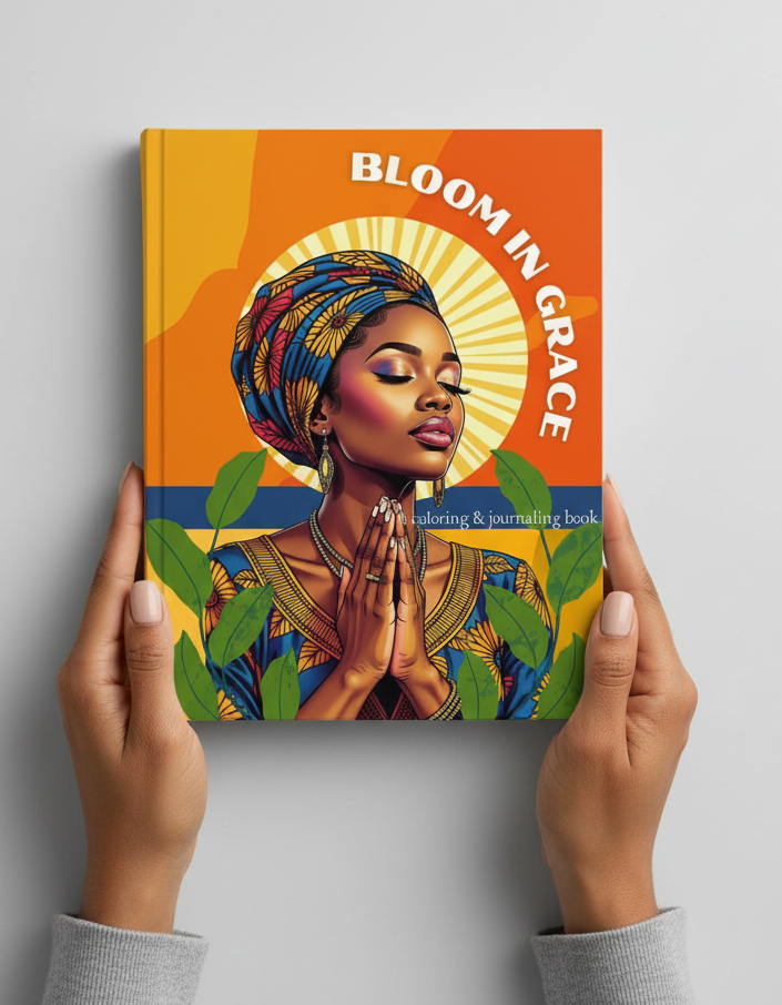 Book titled 'Bloom in Grace' held by hands against a gray background