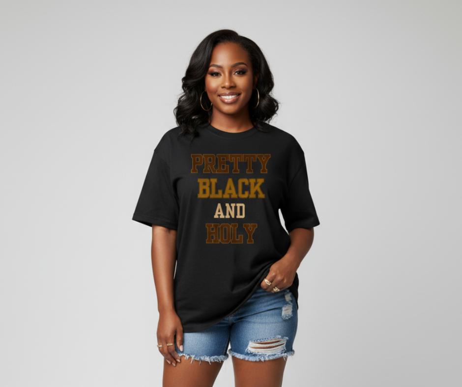Woman wearing a black t-shirt with 'Pretty Black and Holy' text on a gray background