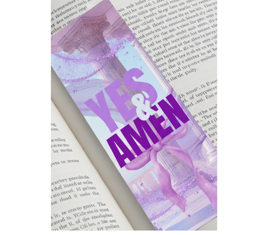 Book with a decorative ribbon labeled 'YES & AMEN' on an open book